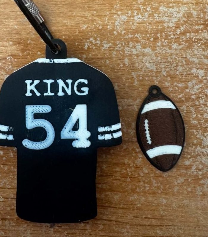 Example custom football jersey keychain in black and gold